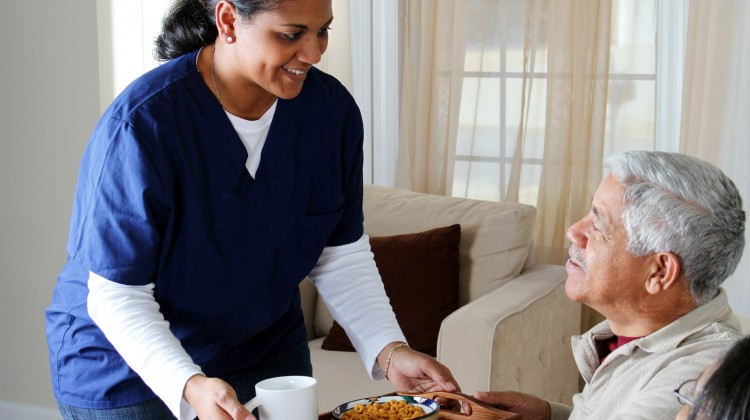 Home health care worker and an elderly couple